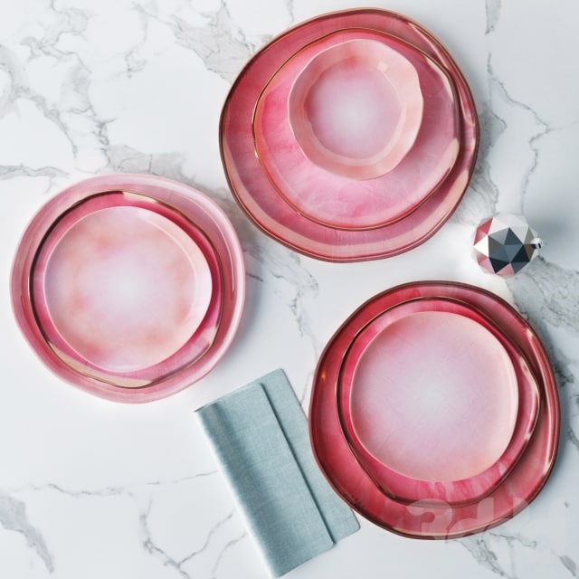 A set of plates in pink glaze of irregular shape