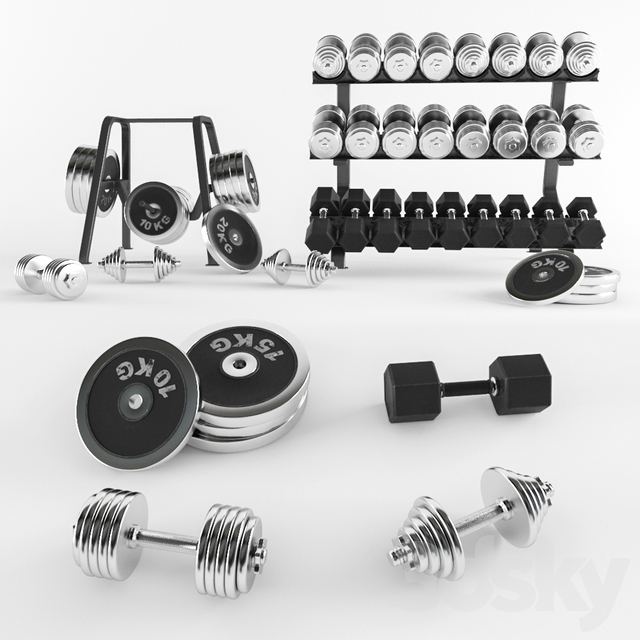 A set of sports dumbbells and pancakes on the racks